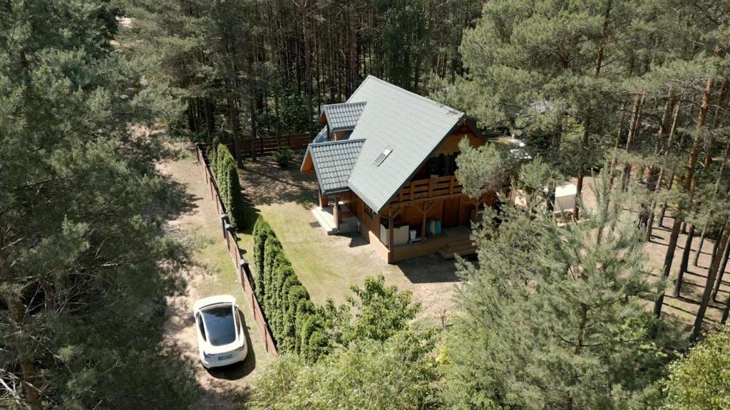 an overhead view of a house in the woods at Forest Home Dębowa 18 in Łuka