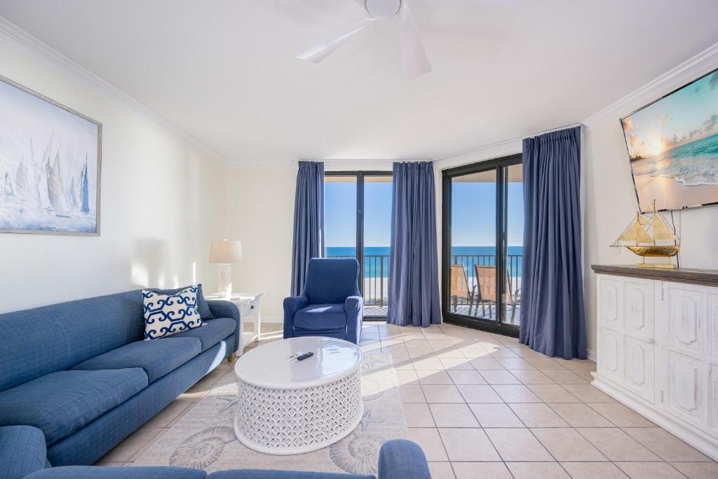 a living room with a couch and a table at Phoenix X 504 in Orange Beach