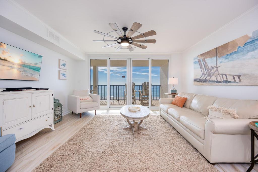 a living room with a couch and a table at Wind Drift 310S condo in Orange Beach
