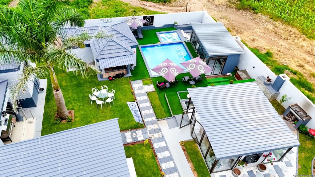 an aerial view of a house with a swimming pool at Siyamthanda Boutique in Louis Trichardt