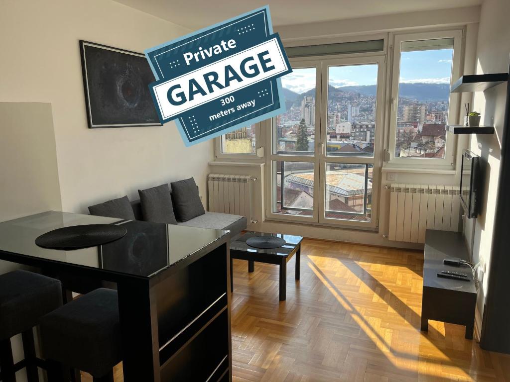 a living room with a sign that reads private garage at Penthouse in Užice