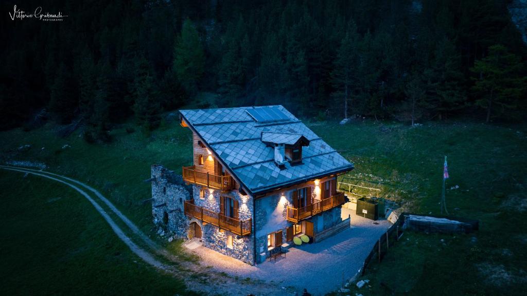 an aerial view of a house with a blue roof at Rifugio Combe D'Imbert Vittoria in Champ Quartier