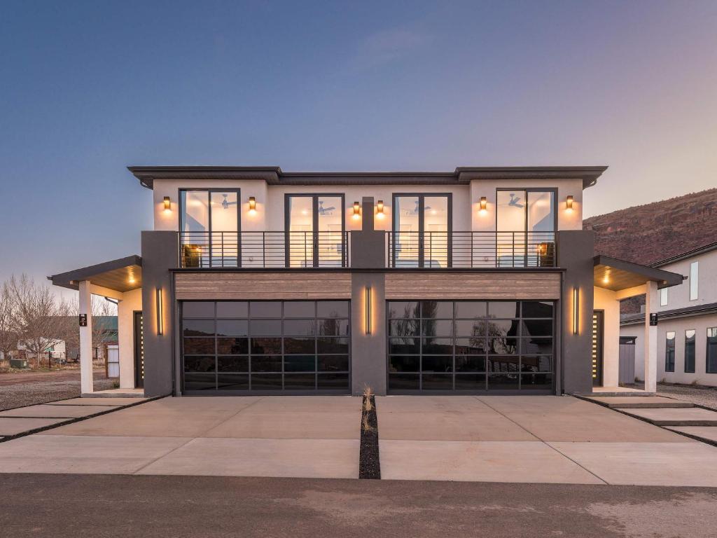 a house with a balcony on top of it at New Modern Luxury at Copper View Moab in Moab