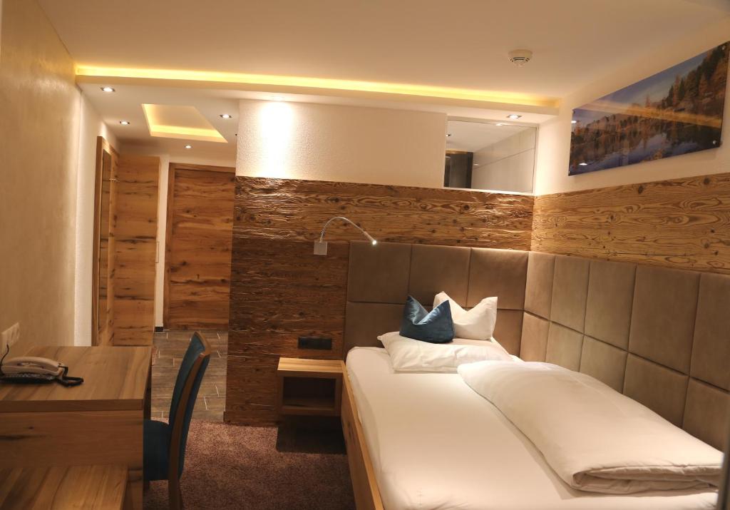 Postel nebo postele na pokoji v ubytování Hotel Vogt