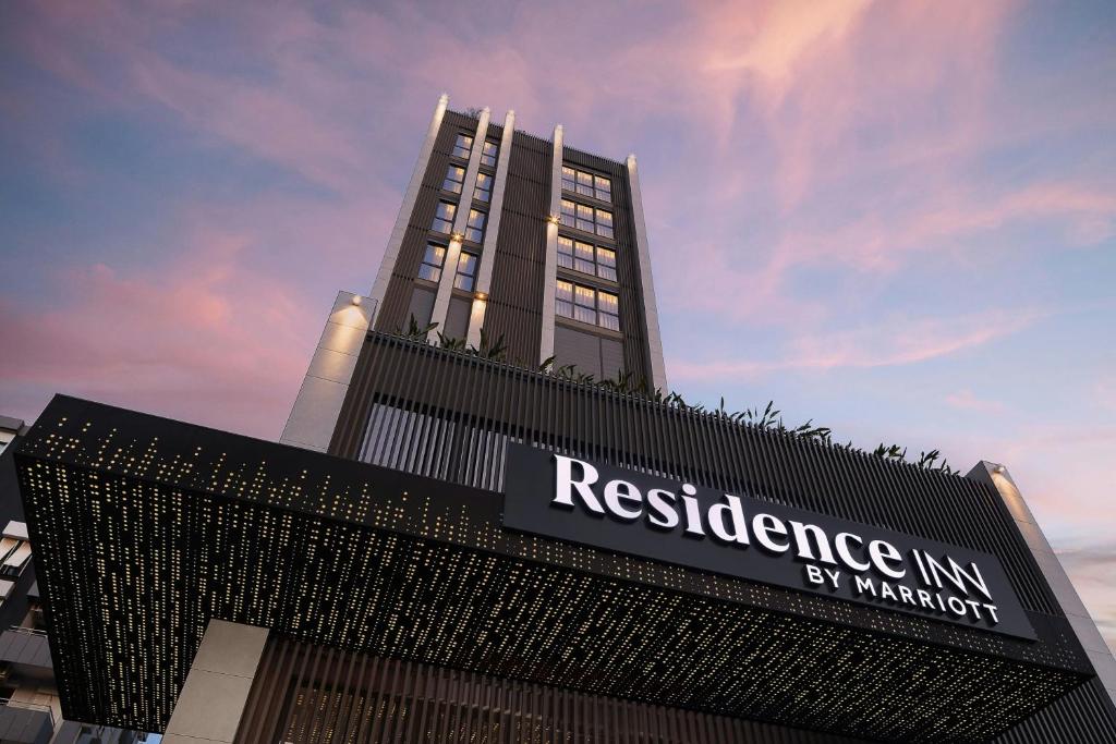 a tall building with a sign on top of it at Residence Inn by Marriott Antalya in Antalya