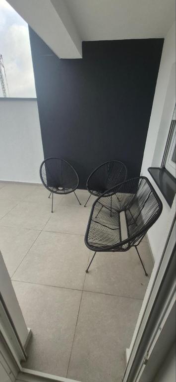 two black chairs sitting on top of a building at Premijum 5 in Smederevska Palanka