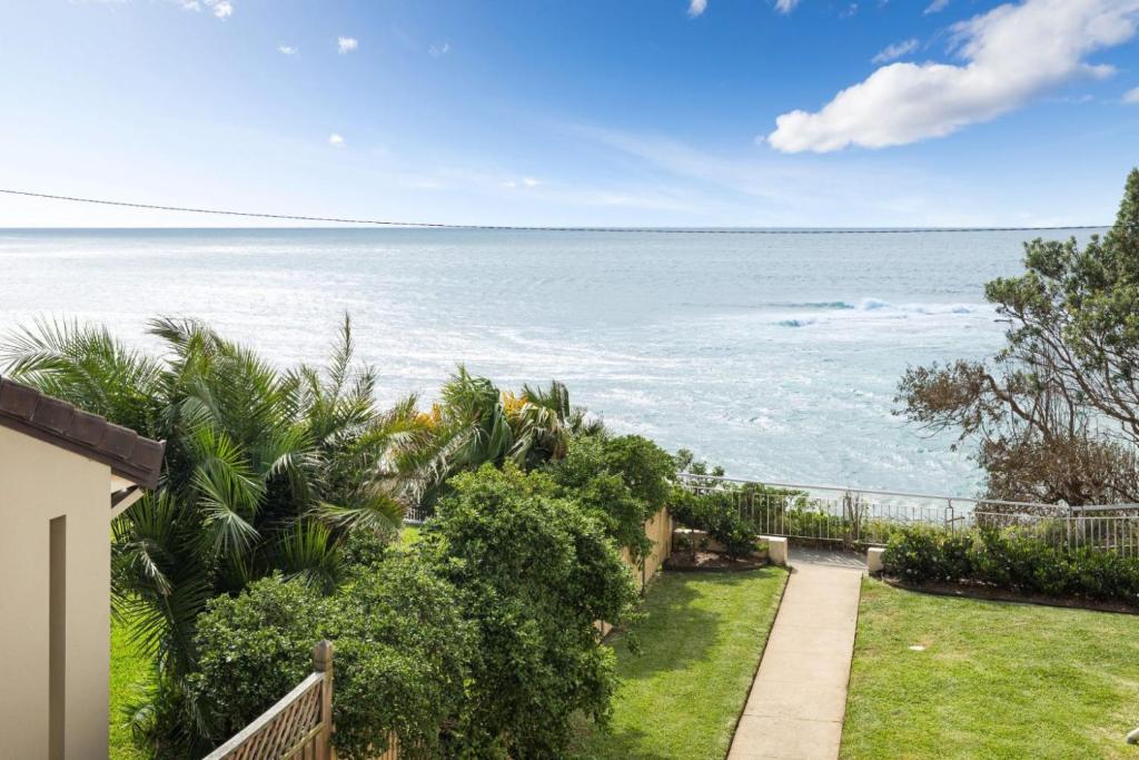 a view of the ocean from a house at North Facing Seaside Apartment in Cronulla