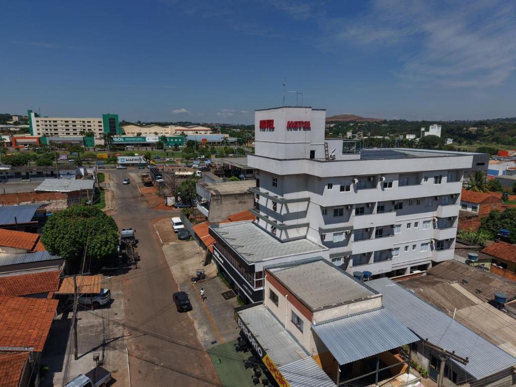 an overhead view of a city with a white building at Hotel Seven in Goiânia