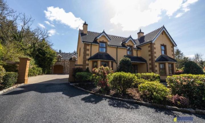 a large house with a driveway in front of it at Shamrock House in Fintona