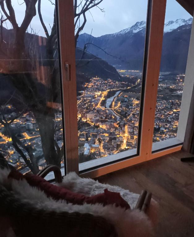 a view of a city from a window at Foresteria B&B Vecchiascuola Pianazzola in Chiavenna