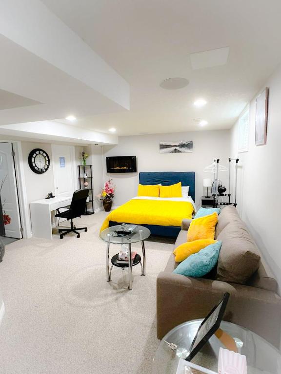 a living room with a bed and a couch at Amazing cozy fully private studio in London