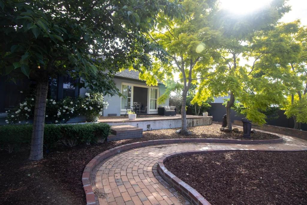 a brick walkway in front of a house at Buninyong Golfside Getaway in Buninyong