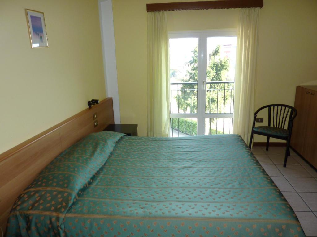 Postel nebo postele na pokoji v ubytování Hotel Del Fiume
