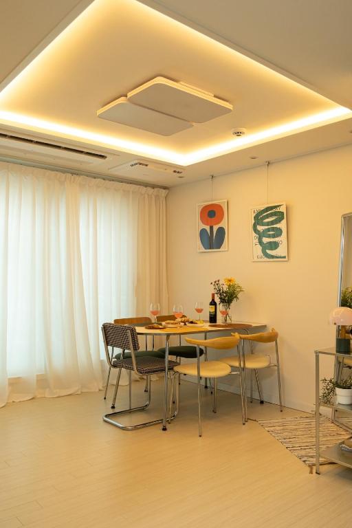 a dining room with a table and chairs at ABC Stay in Seoul