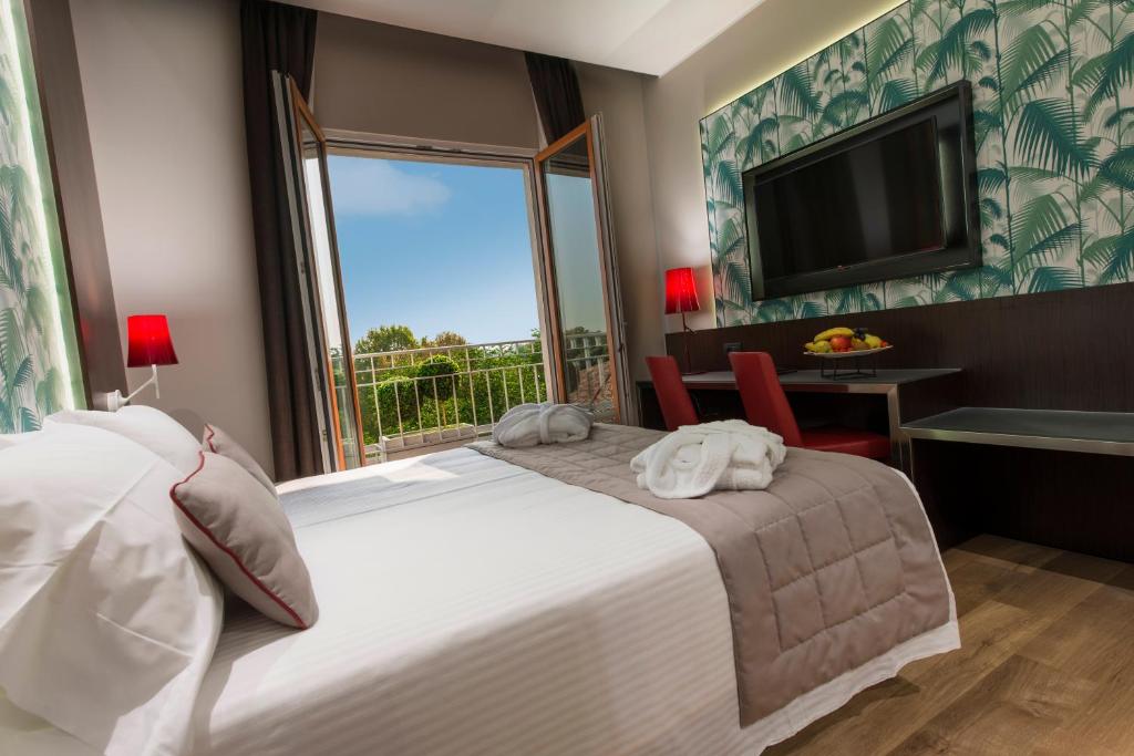 Ліжко або ліжка в номері Hotel Manin