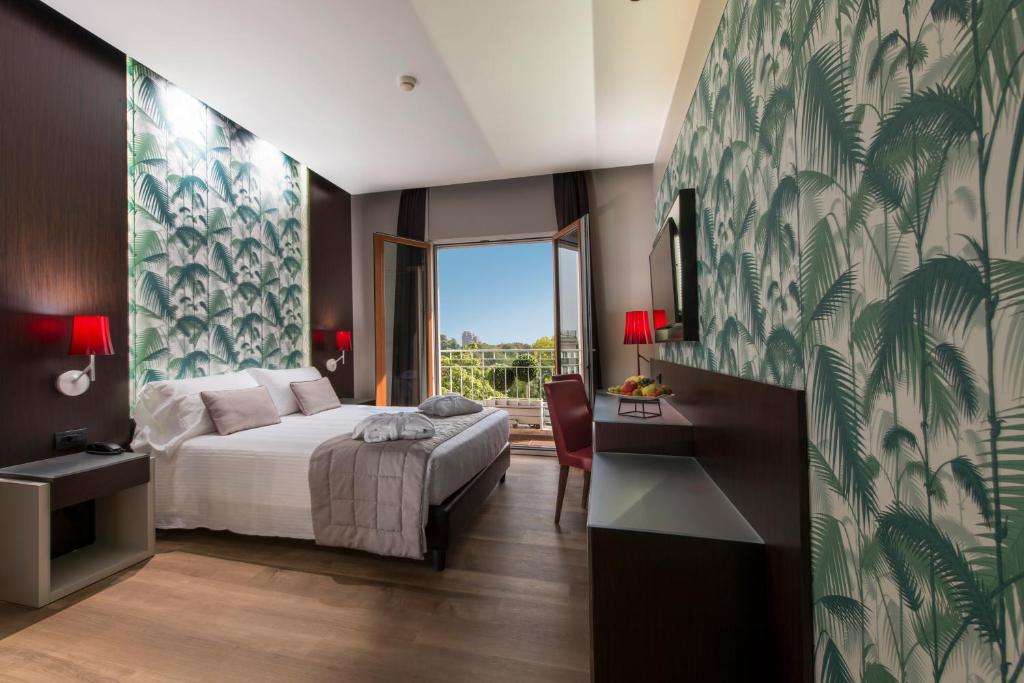 Ліжко або ліжка в номері Hotel Manin