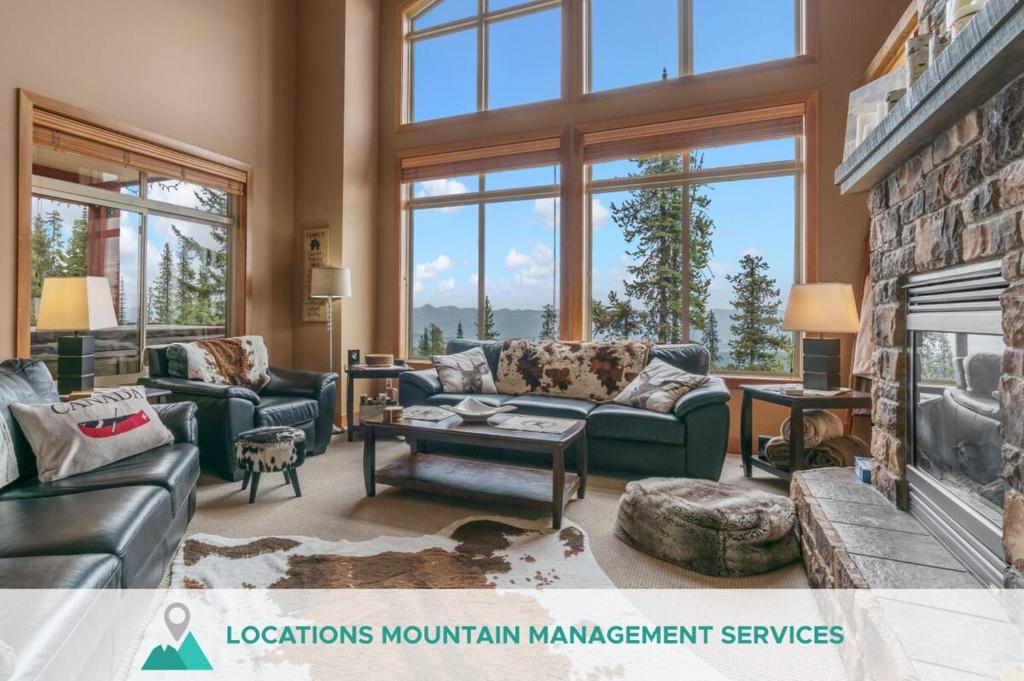 a living room with a couch and a fireplace at Blackrock 6 in Big White