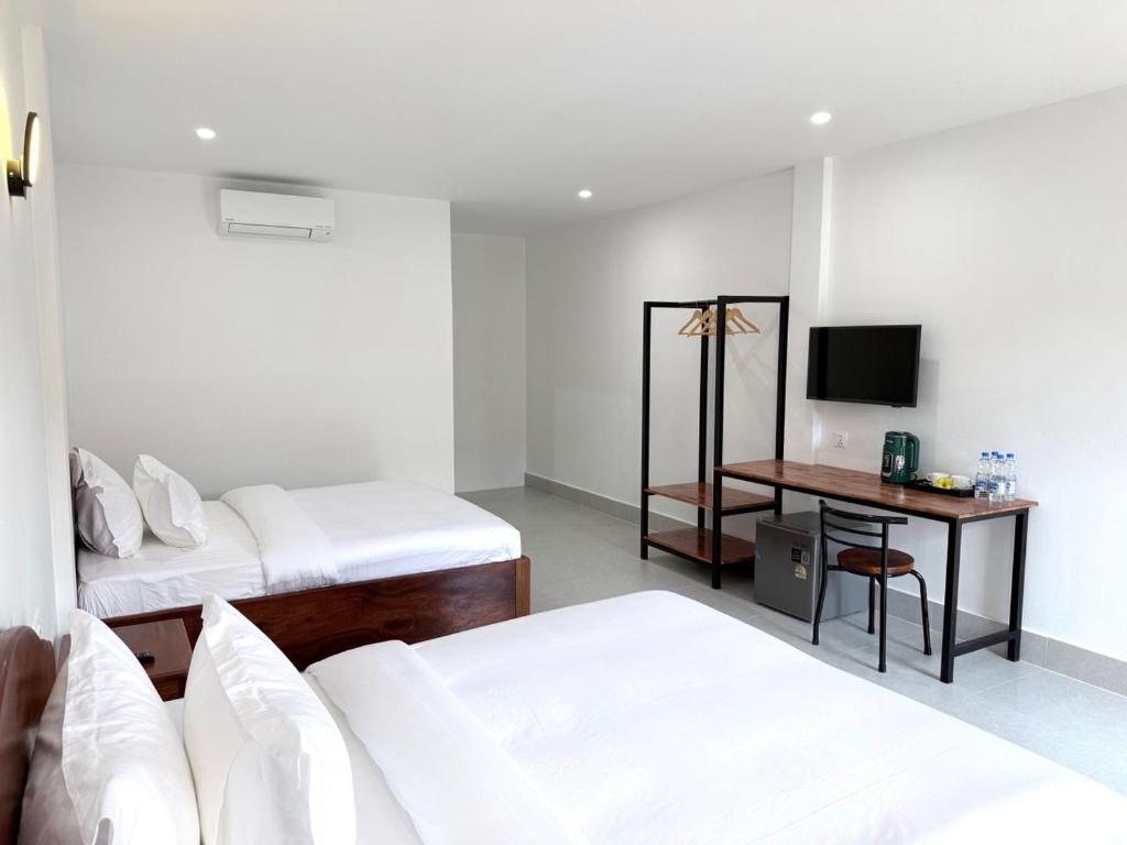For Rest Inn tesisinde bir odada yatak veya yataklar