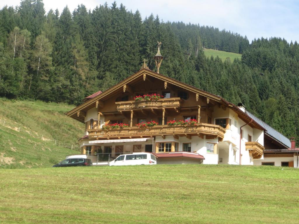 a large building with a balcony on top of it at Ascherhof in Auffach