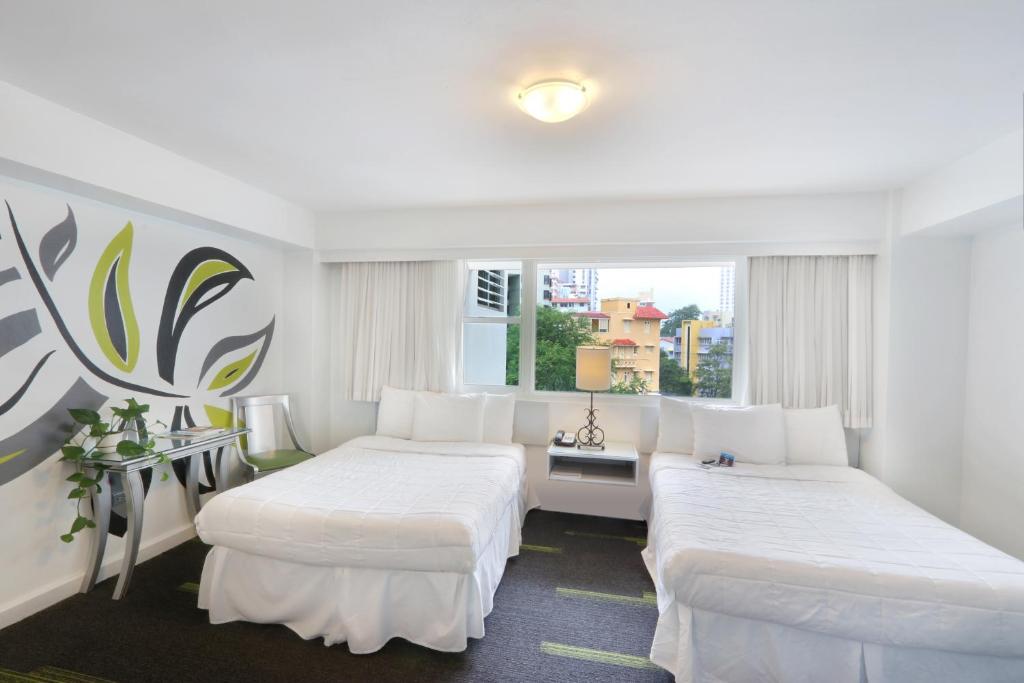 Postel nebo postele na pokoji v ubytování Hotel Miramar