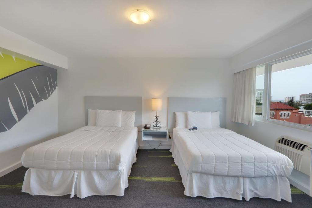 Postel nebo postele na pokoji v ubytování Hotel Miramar
