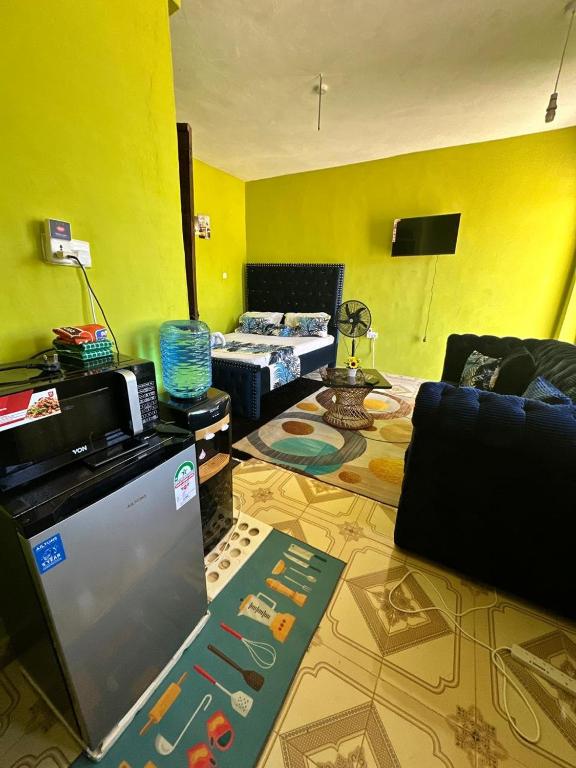 a living room with a couch and a table at ADONAI homes in Malindi