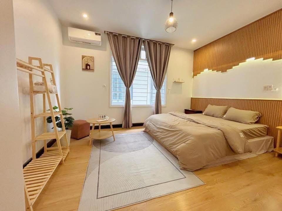 a bedroom with a bed and a ladder in it at Chu homestay in Thôn Trường Giang