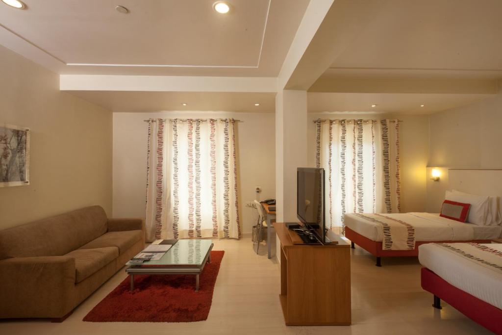 TV a/nebo společenská místnost v ubytování Avalon Courtyard Residence Suites