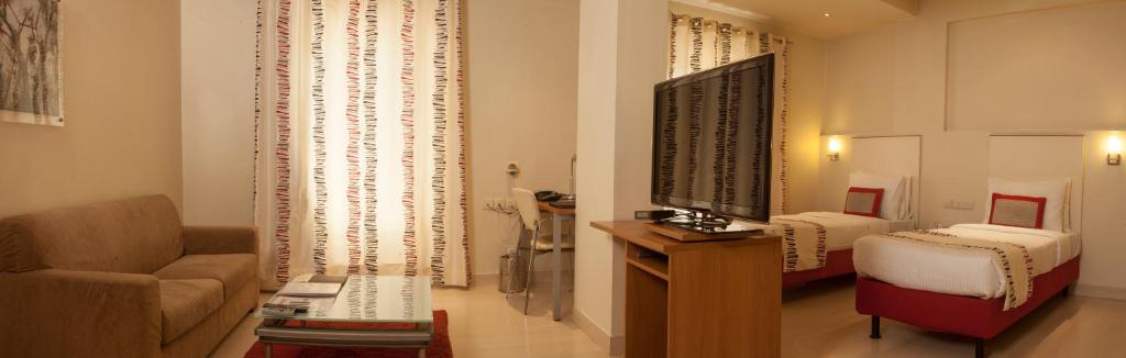 Postel nebo postele na pokoji v ubytování Avalon Courtyard Residence Suites