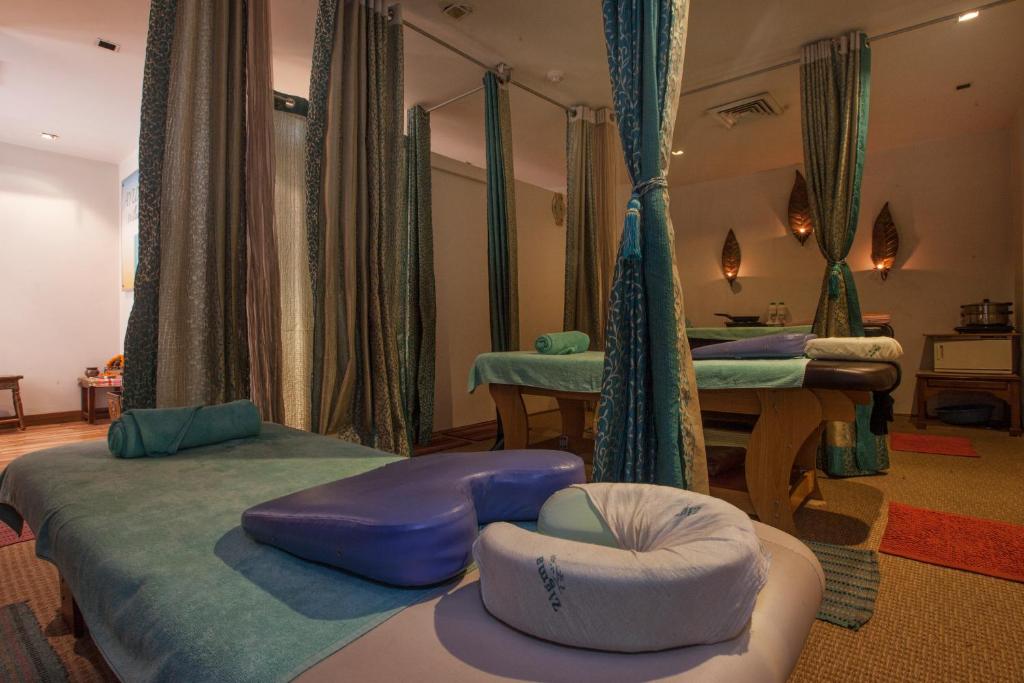 Postel nebo postele na pokoji v ubytování Avalon Courtyard Residence Suites