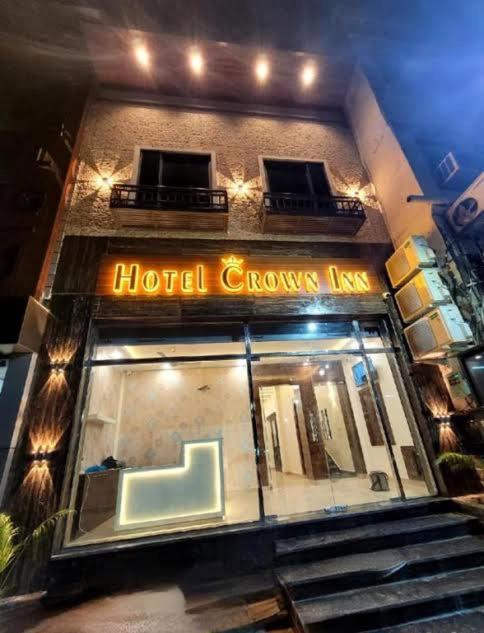 a hotel grows us sign on the front of a building at Hotel Crown Inn in Jalandhar
