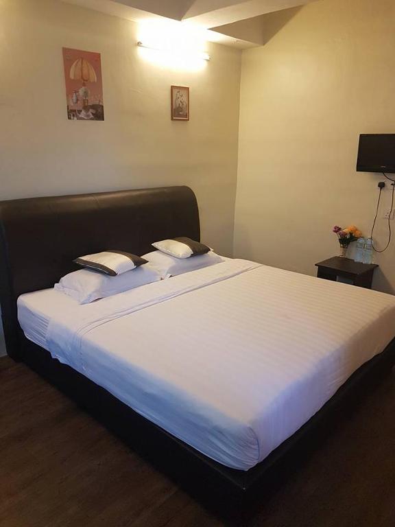 Postel nebo postele na pokoji v ubytování JAM Hotel Kota Warisan Sepang @ ERL Salak Tinggi, KLIA 1-2 & F1