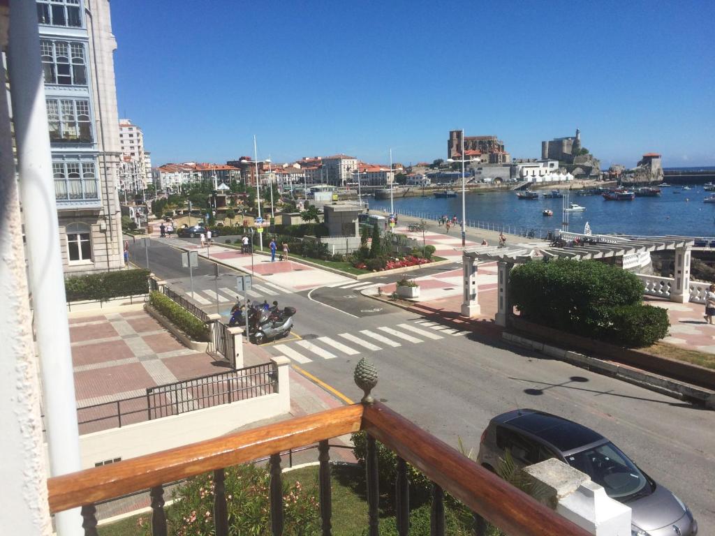 a balcony with a view of a city and a street at Villa Floren Castro Urdiales in Castro-Urdiales