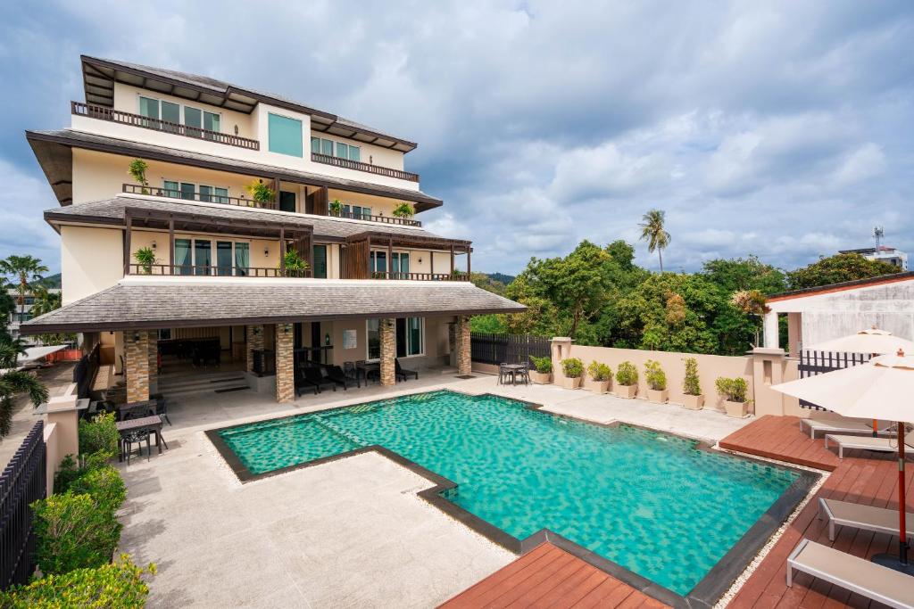 an aerial view of a villa with a swimming pool at Ratana Hotel Chalong in Rawai Beach