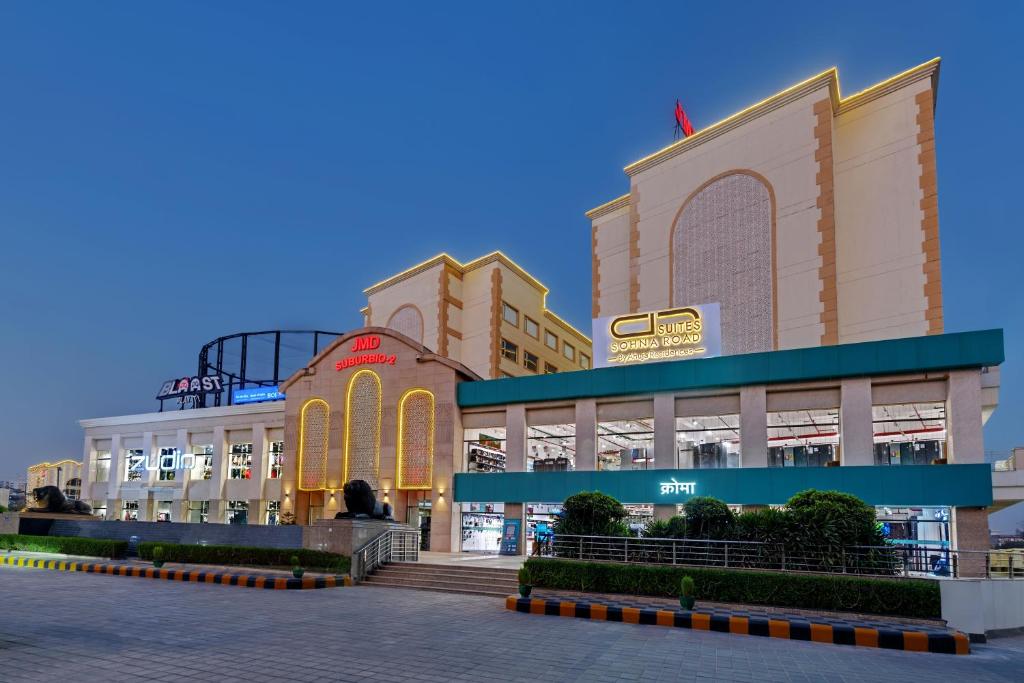 a shopping mall in a city at dusk at AR Suites Sohna Road in Gurgaon