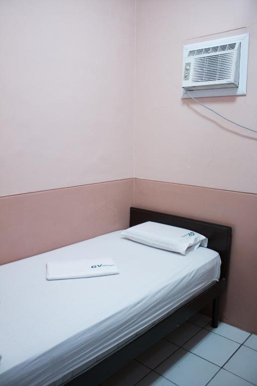 Postel nebo postele na pokoji v ubytování GV Hotel - Borongan