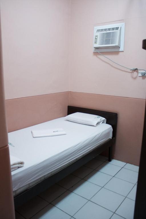 Postel nebo postele na pokoji v ubytování GV Hotel - Borongan