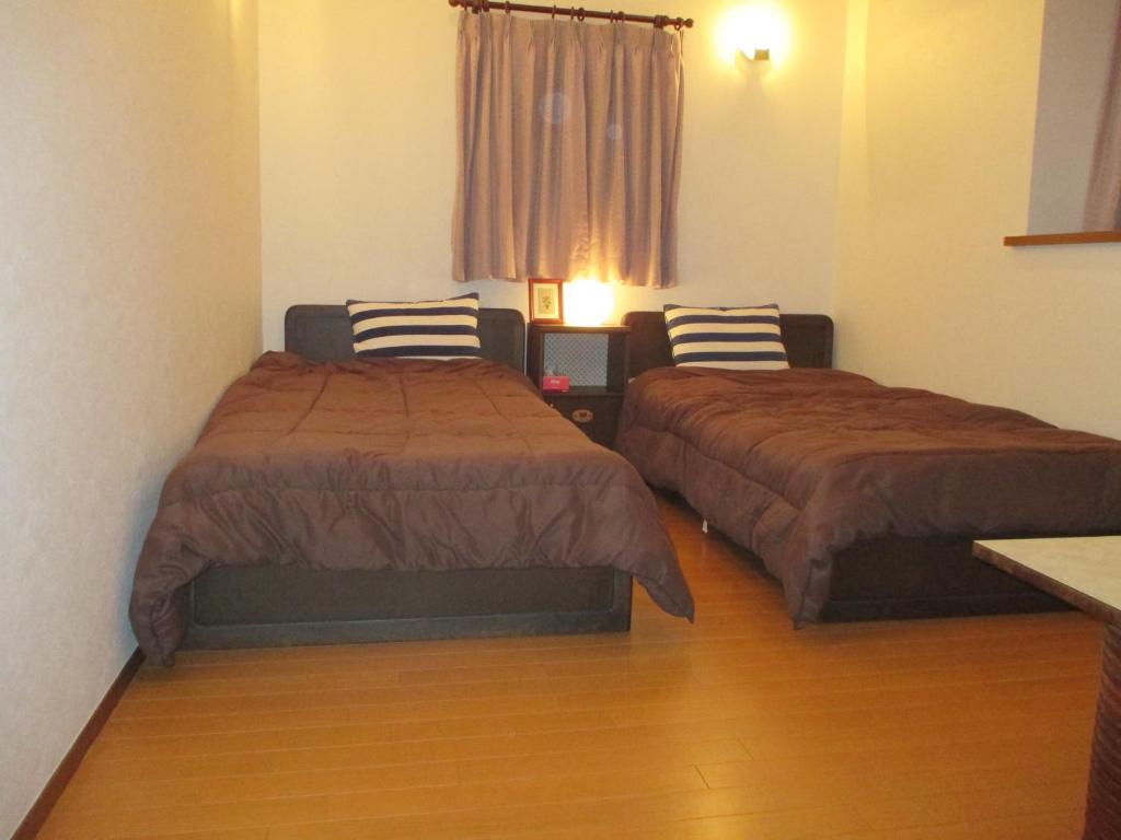 Postel nebo postele na pokoji v ubytování Jemsty Inn Hakone Ashinoko