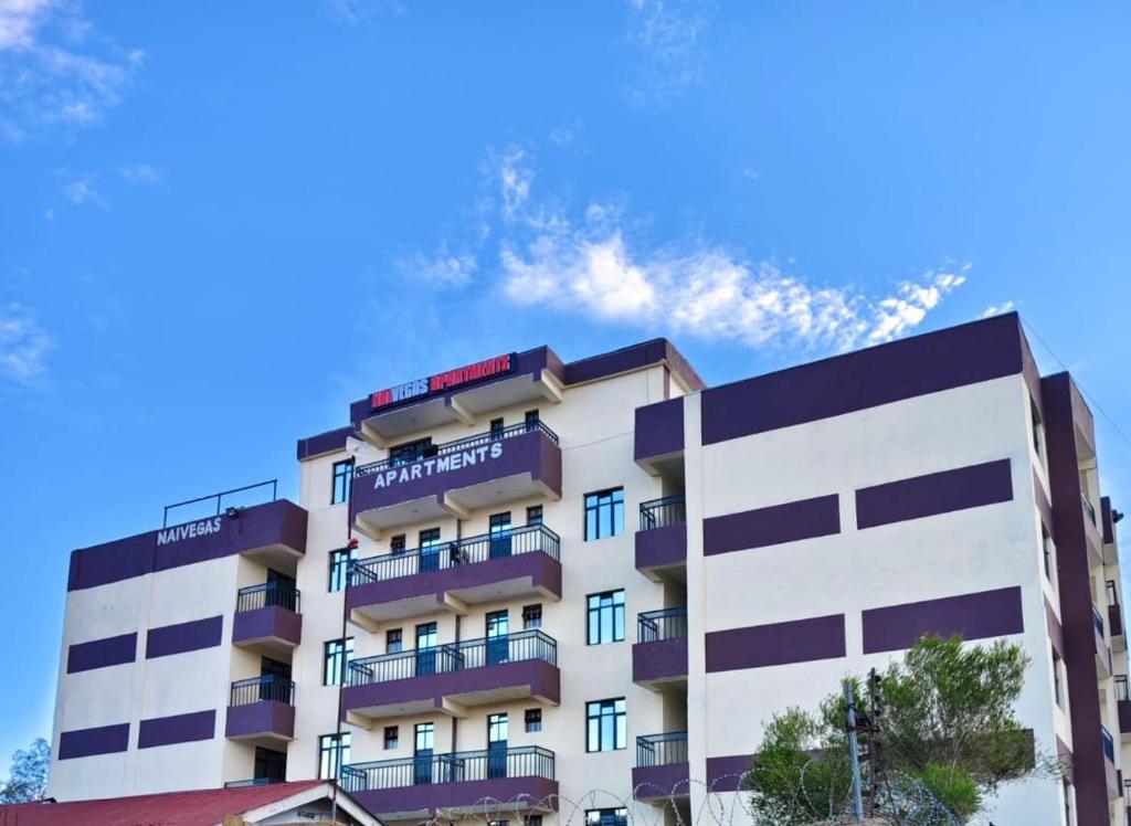 a building with balconies on the side of it at Luxe homes in Munyu