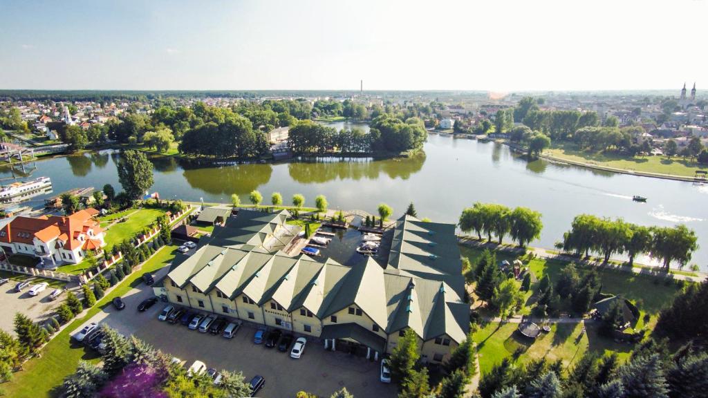 an aerial view of a building next to a river at Hotel Nad Nettą in Augustów