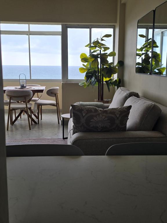 a living room with a couch and a table at 407 Afsaal in Amanzimtoti
