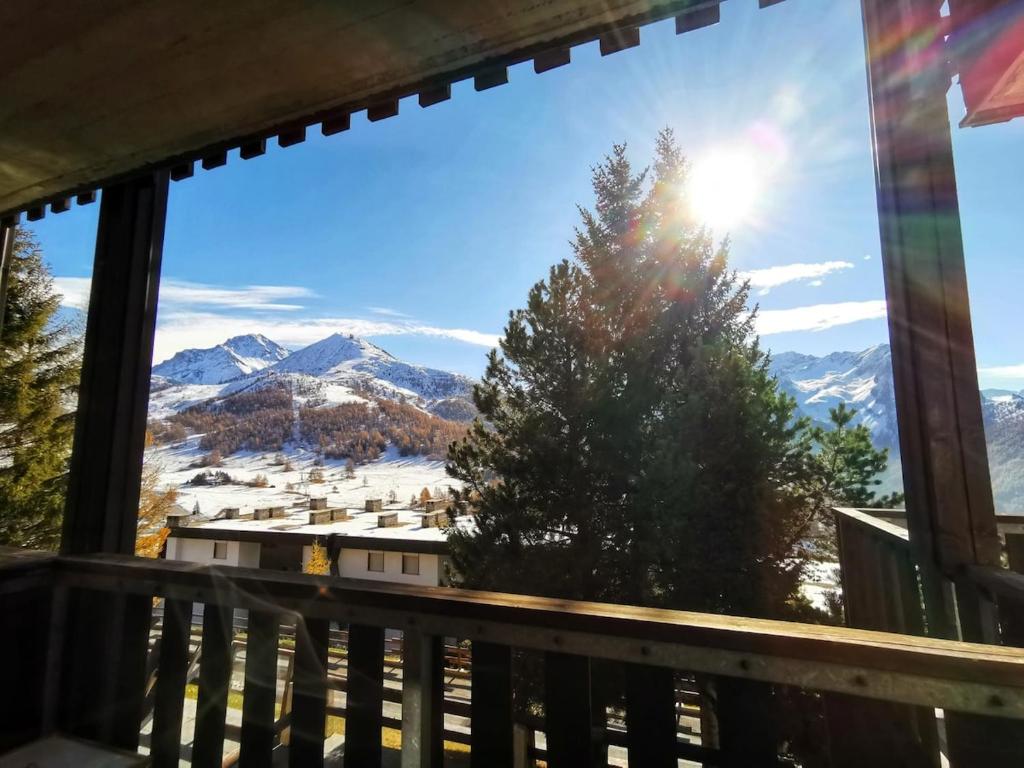 a view of the mountains from the balcony of a house at Casa Verde in Sestriere
