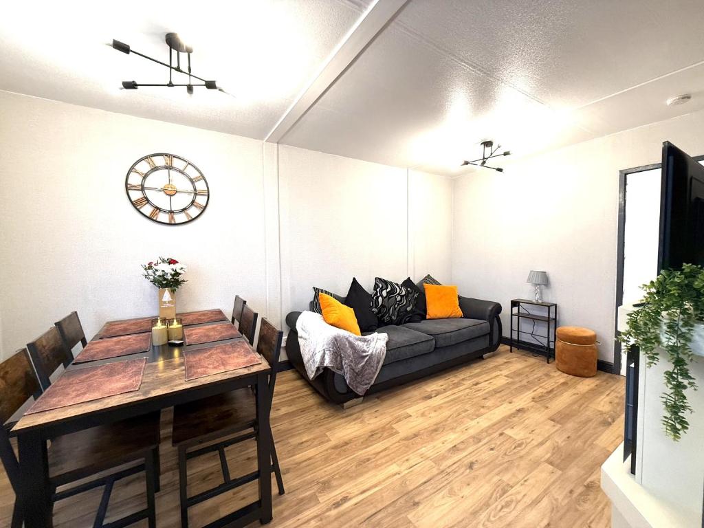 a living room with a couch and a table at Bayside in Bridlington