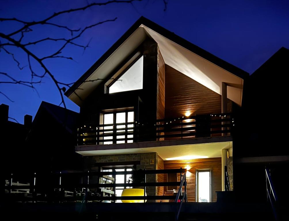 a house at night with the lights on at Luxury Housing in Formigal in Formigal