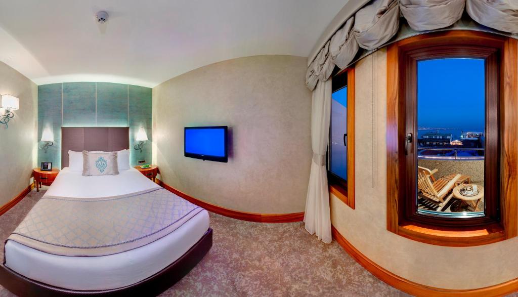 Postel nebo postele na pokoji v ubytování Biz Cevahir Hotel Sultanahmet
