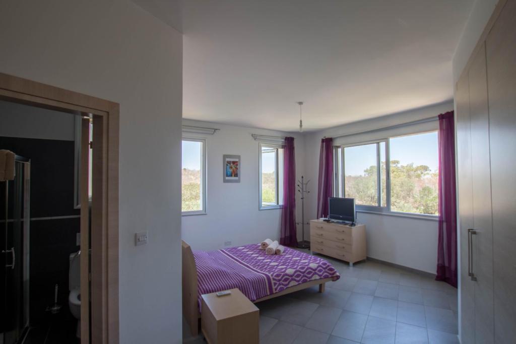 Postel nebo postele na pokoji v ubytování Akefalou Bay Villa