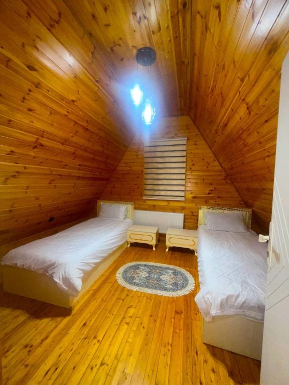 Llit o llits en una habitació de Quba Qecresh Aframe