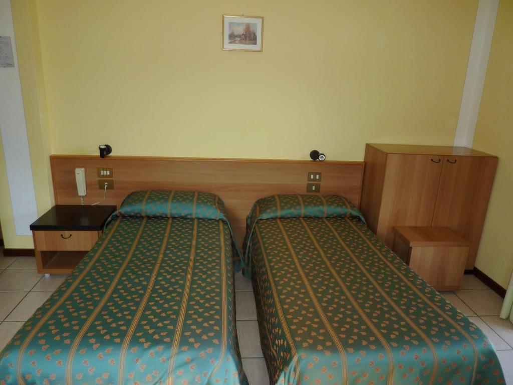 Postel nebo postele na pokoji v ubytování Hotel Del Fiume