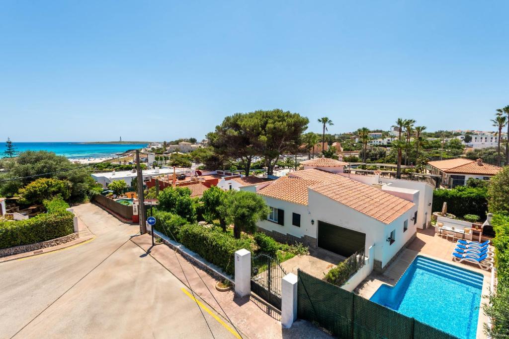 an aerial view of a house with a swimming pool at Villa Margarita Punta Prima by Escape Home in Punta Prima
