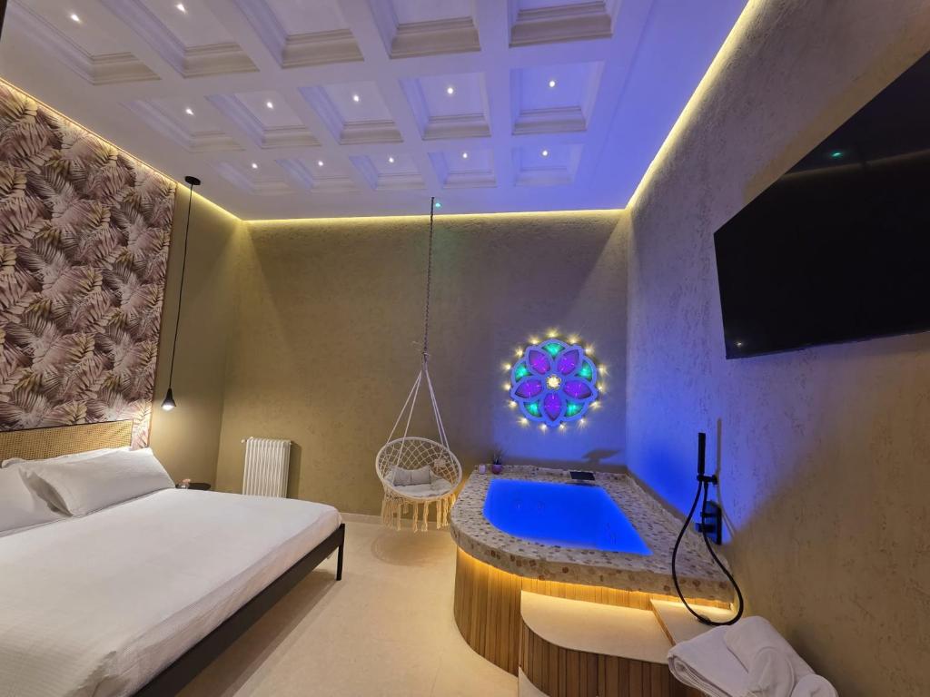 a bedroom with a swing bed and a blue light at Erbanova al Borgo Suite in Taranto